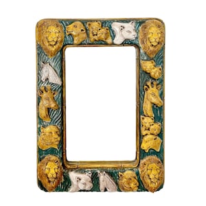 May include: An ornate rectangular picture frame with a jungle animal theme. The frame is painted with gold, green, and brown colors. Lions, giraffes, and other animals are sculpted around the frame's border.