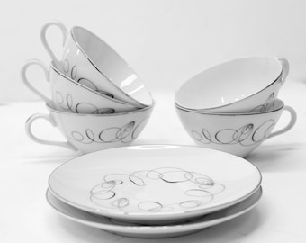 Vintage Meito Japan Tempo 5 Cups with 2 Saucers MCM Atomic Swirl