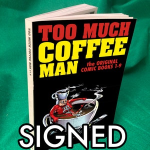 May include: A black and white comic book titled "Too Much Coffee Man" with the text "The Original Comic Books 1-9" and "Signed" in white letters. The cover features a cartoon character in a red suit sitting in a giant coffee cup.