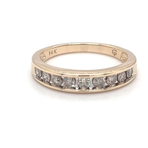 Lovely 14 k yellow gold channel set band