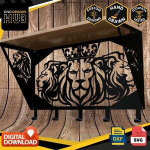 May include: Black metal wall-mounted coat rack with a design of three lion heads, one wearing a crown. The rack has five hooks and a wooden shelf. The design is available for digital download in DXF and SVG formats.
