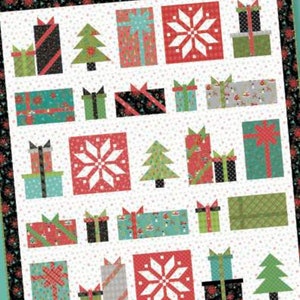 May include: Snowed In Sampler quilt pattern featuring a variety of Christmas-themed blocks, including presents, snowflakes, and Christmas trees. The pattern is by Heather Peterson for Anka's Treasures.