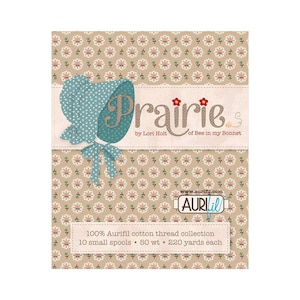 May include: A brown and white floral pattern background with a blue bonnet and the text "Prairie by Lori Holt of Bee in my Bonnet". The text "www.aurifil.com" and the Aurifil logo are also visible. The text "100% Aurifil cotton thread collection 10 small spools 50 wt 220 yards each" is at the bottom of the image.