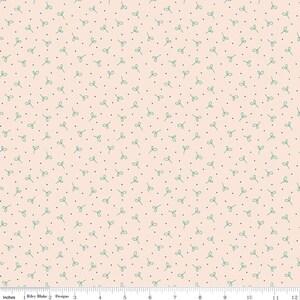 May include: A light peach-colored fabric with a repeating pattern of small green leaf shapes and tiny black dots. The design is evenly spaced across the material, creating a delicate and whimsical aesthetic. The fabric is measured in inches.