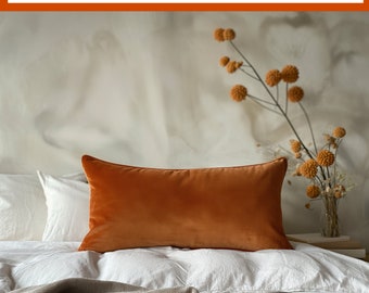 May include: A terracotta velvet cushion cover on a white bed with a beige throw blanket. The text on the image reads: "Terracotta velvet cushion covers made to order. Samples available. Free quotations. Many sizes/shapes possible."