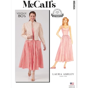 May include: Vintage McCall's sewing pattern for a dress and jacket. The dress is a gingham print with a sweetheart neckline and pockets. The jacket is cream coloured with a polka dot print. The pattern is labelled "Vintage 80's" and "Laura Ashley Since 1953".