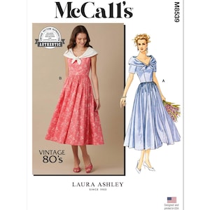 May include: McCall's vintage 80's sewing pattern for a dress with a large collar and bow. The pattern is for a Laura Ashley dress and is designed and printed in the USA.