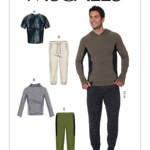 May include: McCall's sewing pattern M7486 featuring athletic wear designs. The image shows a man wearing a hooded sweatshirt and sweatpants. Also shown are illustrations of a short-sleeve shirt, a long-sleeve shirt, and two styles of sweatpants.
