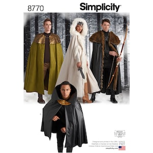 May include: Simplicity pattern 8770 features costume capes. The capes are in various colors, including olive green, black, and white. One cape has a gold-colored, scale-like shoulder piece. Another has a faux fur hood and trim. The image includes the Simplicity logo.