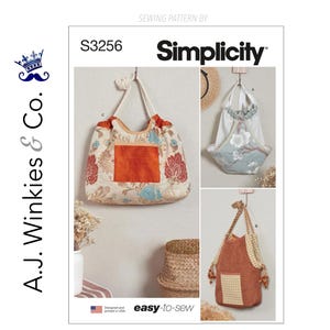 May include: Simplicity sewing pattern S3256 featuring three bag designs. The main bag is cream-colored with a floral pattern and an orange pocket. The other two bags have different shapes and fabrics. The text "easy-to-sew" is also visible.