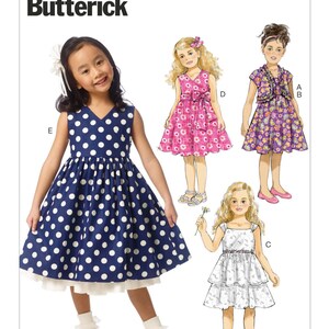 May include: A sewing pattern for girls' dresses, featuring four different styles. The pattern is called B6046 Butterick. The dresses are in various colours and patterns, including polka dots, floral prints, and plain colours.