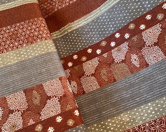 Bands of Japanese patterns on Rust - Dobby Shantung Japanese Cotton - fabric by the 1/4mtr