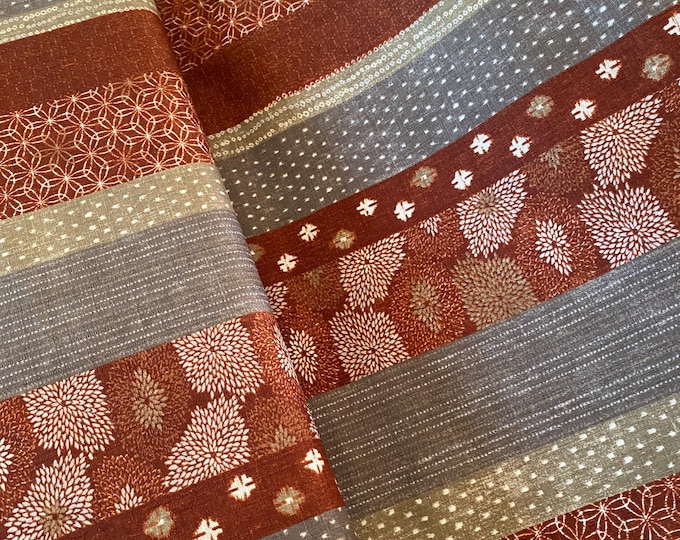 Bands of Japanese patterns on Rust - Dobby Shantung Japanese Cotton - fabric by the 1/4mtr