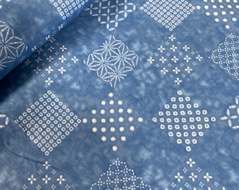Patchwork patterns on a  mid sky blue background