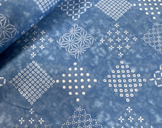Patchwork patterns on a  mid sky blue background