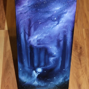 May include: A rectangular canvas painting featuring a dark blue and purple night sky filled with stars above a forest. A figure in a white robe stands in the foreground, holding a glowing white orb that emits a swirling mist into the dark trees.