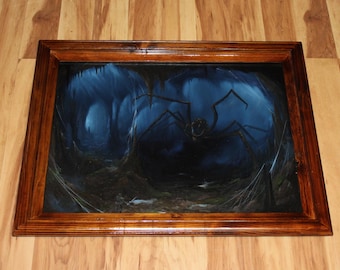 May include: A framed painting of a large, dark spider in a cave setting. The spider has long legs and is surrounded by webs. The cave is dark and mysterious, with blue and purple hues.