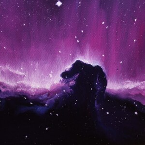 May include: An abstract painting of a nebula in shades of purple, pink, and black. The artwork depicts a cosmic scene with a prominent dark silhouette resembling a horse's head, surrounded by swirling clouds and scattered stars.