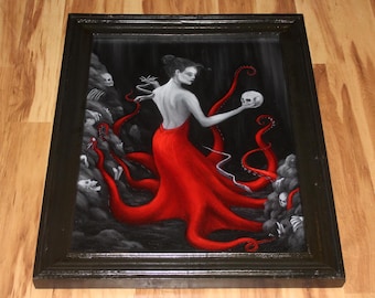 May include: A framed painting of a woman with red hair and a red dress, with tentacles of an octopus emerging from her back. The woman is holding a skull in her right hand. The background is black and white.