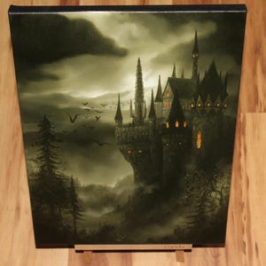 May include: A canvas print depicting a gothic castle on a cliff, under a cloudy sky. The artwork features a dark color palette with shades of gray and green, with birds flying in the sky. The castle has multiple spires and lit windows.