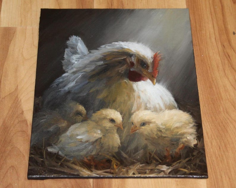 May include: An oil painting depicts a white hen with a red comb, sheltering three yellow chicks in a nest of straw. The artwork uses soft brushstrokes and warm lighting to create a cozy, pastoral scene.
