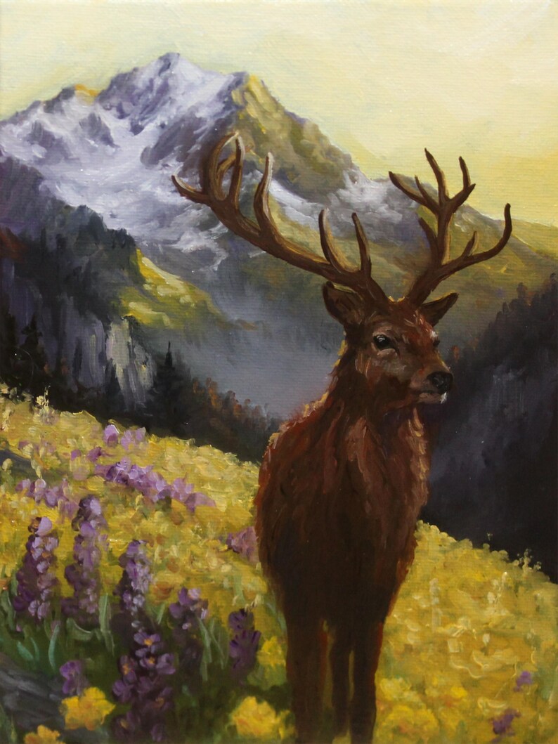 May include: An oil painting shows a deer with large antlers in a field of yellow and purple wildflowers. A snow-covered mountain is in the background, under a yellow sky. The deer has brown fur and is facing right. The painting uses cm measurements.
