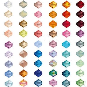 May include: A selection of faceted crystal beads in a range of colours, such as clear, pink, orange, red, purple, blue, and green. The beads are arranged in rows and columns, displaying their different hues and shapes. These beads are suitable for jewellery making.