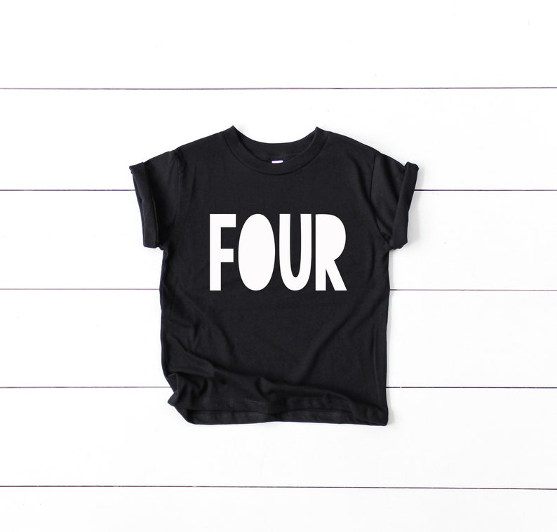May include: Black t-shirt with white text that says "FOUR" on it.
