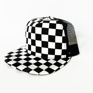 May include: A black and white checkered trucker hat with a mesh back.