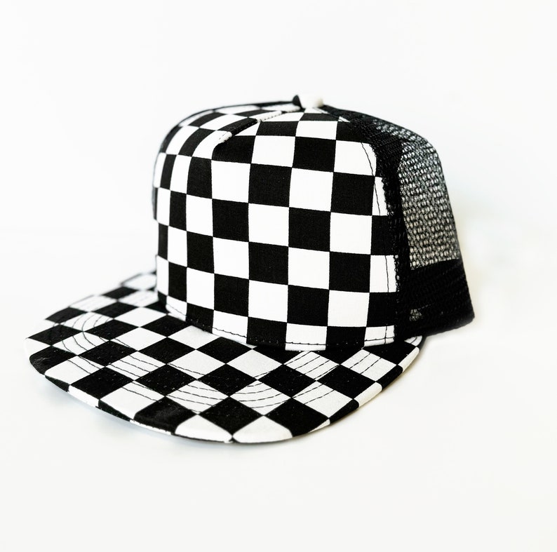 May include: A black and white checkered trucker hat with a mesh back.