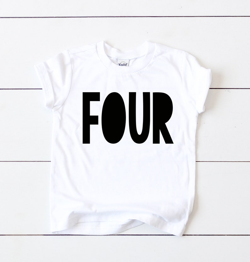 May include: White t-shirt with black text that says "FOUR" in a bold, playful font.