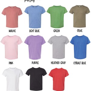 May include: Colour chart showing 12 different t-shirt colours. The colours are: mauve, light blue, green, olive, pink, purple, heather grey, cobalt blue, white, black, and red.