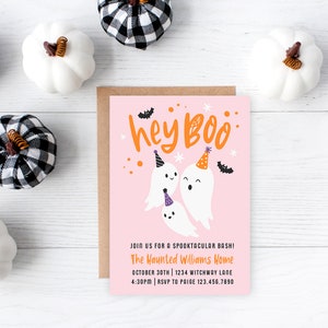 May include: A pink Halloween party invitation with the words "hey Boo" in orange. The invitation features cartoon ghosts wearing party hats and bats. White and black plaid pumpkins and white pumpkins surround the invitation.