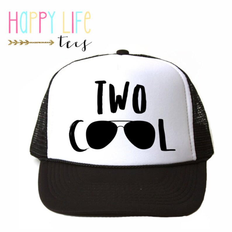 May include: White and black trucker hat with the text "TWO COOL" and sunglasses graphic.