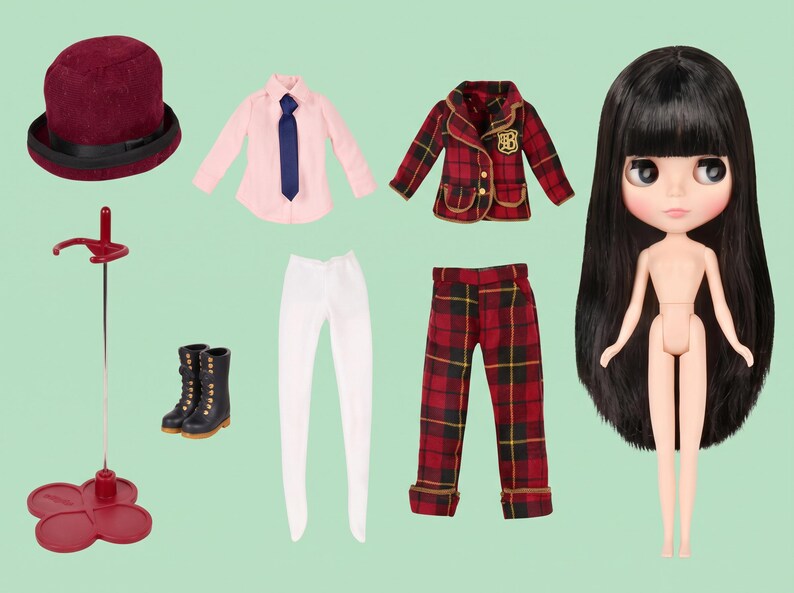 May include: A doll with long black hair, a burgundy top hat, a light pink long-sleeve shirt with a blue tie, a red and black plaid blazer with a gold emblem, white leggings, red and black plaid trousers, black lace-up boots, and a doll stand.