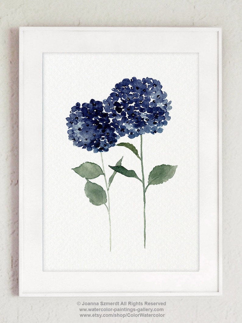 May include: A watercolor painting of two blue hydrangeas with green leaves and stems. The painting is framed in a white frame.
