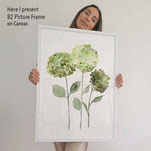 May include: A white framed canvas print featuring a watercolor painting of three green hydrangeas with stems and leaves.