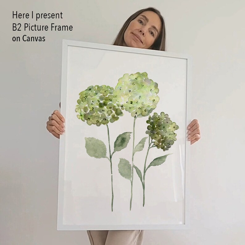 May include: A white framed canvas print featuring a watercolor painting of three green hydrangeas with stems and leaves.