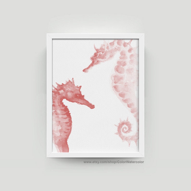 May include: Watercolor painting of two pink seahorses on a white background. The seahorses are facing each other, with one slightly larger than the other. The painting has a delicate and whimsical feel.