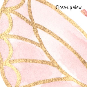 May include: Close-up view of a pink and gold butterfly wing with a delicate, intricate pattern. The wing is painted with a watercolor effect and has a shimmery gold outline.