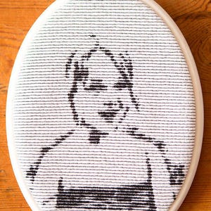 Embroidered framed portret