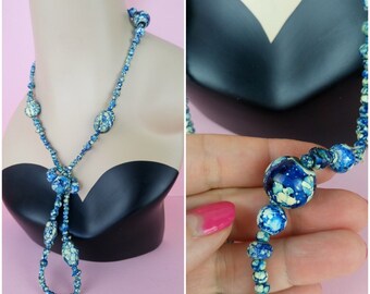 Vintage jaren '30 lange blauwmarmeren glazen ketting/kralenketting in flapstijl