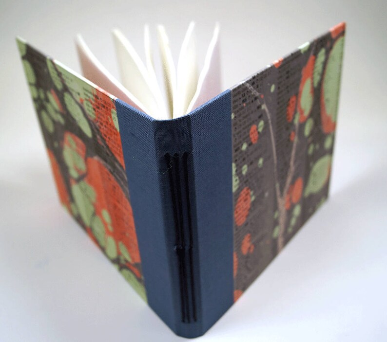 Small hand-bound notebook with marbled cover
