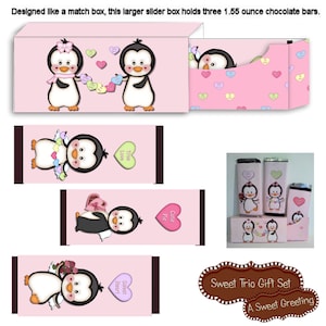 May include: Pink gift set with penguin illustrations, including a matchbox-style box and chocolate bar wrappers. The box holds three 1.55-ounce chocolate bars. The set features heart-shaped candies and the text "Sweet Trio Gift Set".