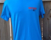 Vintage 1987 XL Paul Young quot World Tour 1987 quot turquoise blue concert t-shirt. Ched shirt by Anvil brand, 50 polyester and 50 cotton, Made in
