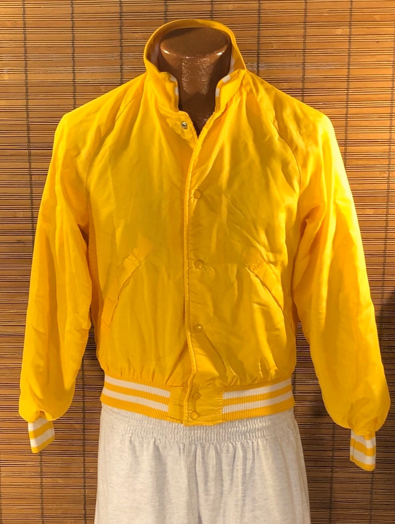 18-20 Cuckoo\u2019s Nest Baseball Type Jacket Terrific yellow color Fun graphics on the back Vintage 1980\u2019s Youth XL 6 snap closures on the