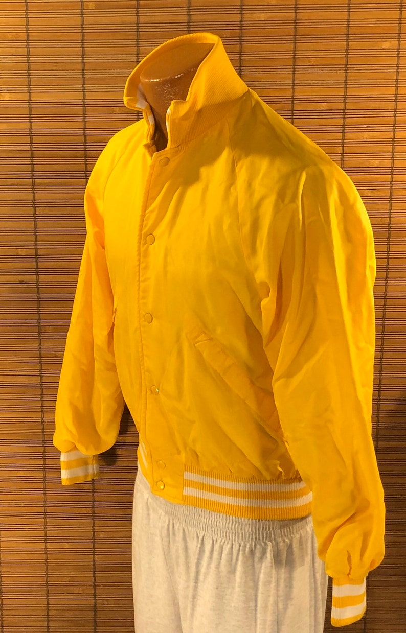 18-20 Cuckoo\u2019s Nest Baseball Type Jacket Terrific yellow color Fun graphics on the back Vintage 1980\u2019s Youth XL 6 snap closures on the