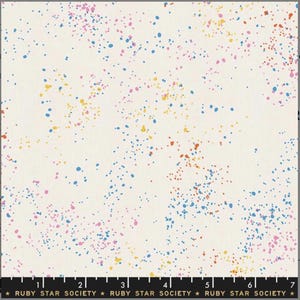 May include: White fabric with a scattered pattern of small blue, pink, yellow, and orange dots.