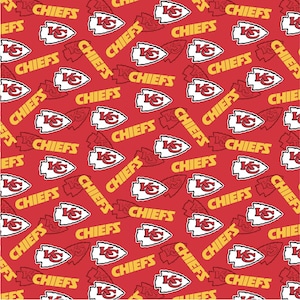 May include: A red fabric pattern featuring the Kansas City Chiefs logo, which consists of a white arrowhead shape with a red KC monogram, interspersed with the word CHIEFS printed in bold yellow capital letters throughout the repeating design.