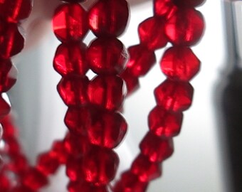 1 Strand of 25 Faceted Irregular Ruby Red Glass Beads, Czechoslovakian, approx 7mm